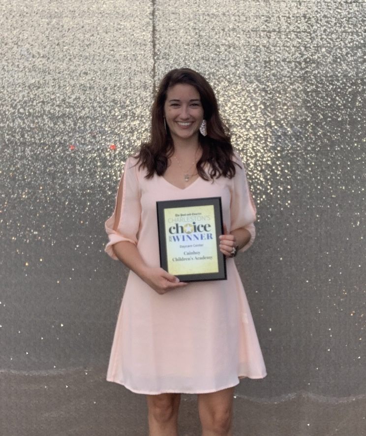 Lindsey Draugel holding the Charleston's Choice award for her preschool